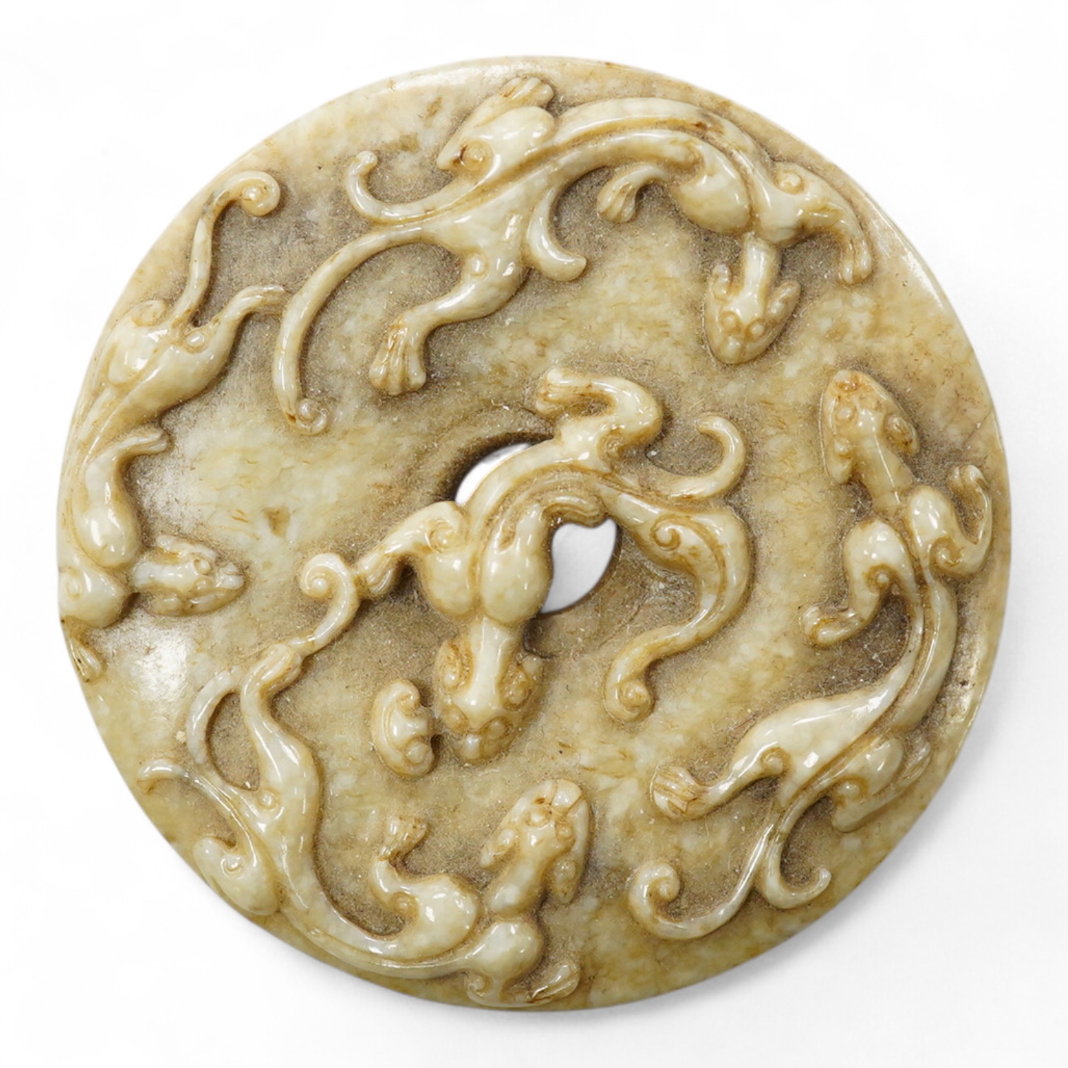 A Chinese russet jade bi disc, 5cm diameter